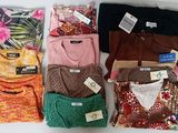 a lot of clothes that are sitting on a table