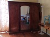 an image of a bedroom scene with focus on the armoire