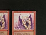 two cards that are sitting on a table