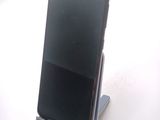 a cell phone that is sitting on a stand