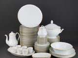 a lot of plates and cups on the table