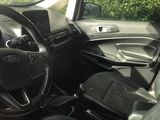 dashboard view of a car with a steering wheel and a dash board
