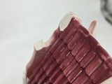 a toothbrush that has a red brush in it