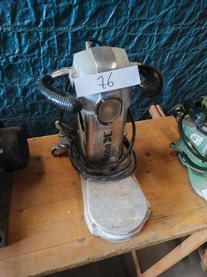 a machine that is sitting on top of a wooden table