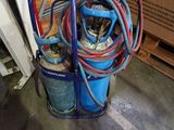 an image of a gas can with a hose attached to it