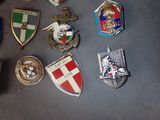 a lot of badges that are on a table