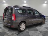 a small grey van that is parked in a room