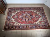 an oriental rug on the floor in a room