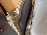 a chair that is sitting in front of a bed