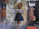barbie doll in a box with clothes and accessories on display