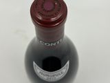 a bottle of wine that is sitting on a table