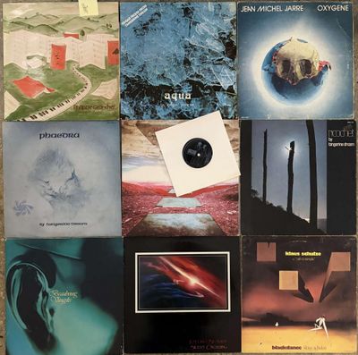 various album covers of various types and sizes on a table