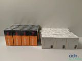 Trois boîtes de jeux Nintendo Wii sont posées sur une table
