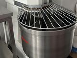an image of a large industrial mixer in a kitchen