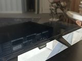 a television sitting on top of a table in a living room