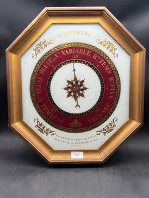 a close up of a framed picture of a maple leaf