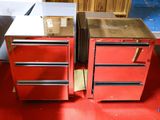 two red drawers that are sitting on a red floor