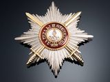 a close up of a badge on a black surface