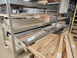 many shelves of wood and metal in a warehouse