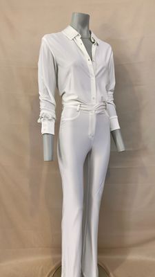 the mannequin is wearing white pants and a white shirt