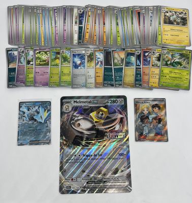 a lot of different pokemon cards on the table