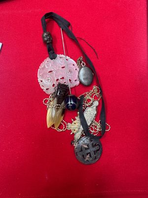 a picture of a necklace on a red cloth