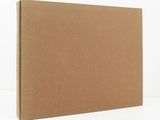a brown cardboard box on a white surface with a white background