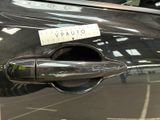 a sticker on the door handle of a car