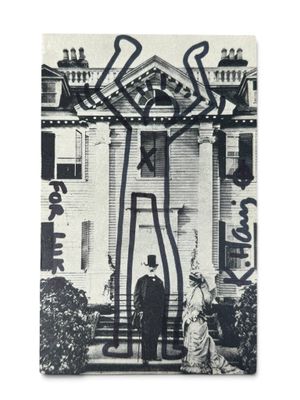an old photo of a man and a woman standing in front of a house
