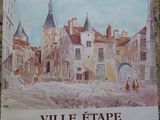 une affiche accrochée au mur d'un immeuble, représentant une ville