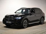 the mercedes suv is parked in a garage with a checkered floor
