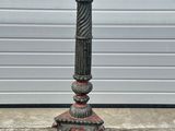 antique cast iron candlesticks with red glass candle holders