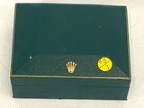 a green box with a gold crown on it