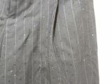 grey pinstripe dress pants with white dots on them and a tag on the bottom