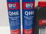 a close up of two bottles of oil and a canister of cleaner