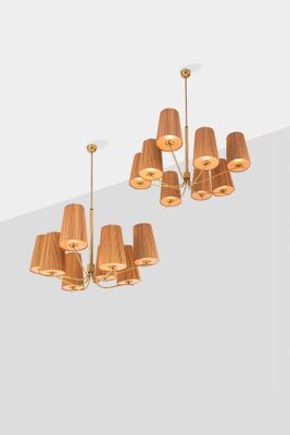 a chandelier made of wood and a lamp shade