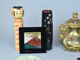 a picture of a collection of vases and pictures on a table