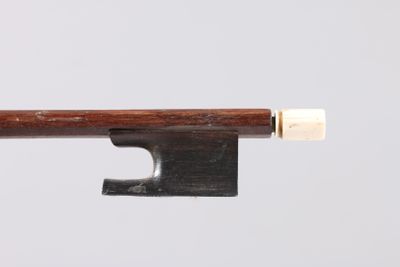 a close up of a violin bow on a white background