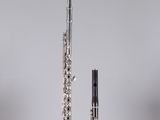 an image of a flute and a flute stand on a table