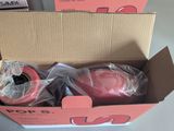 packaging of two rolls of pink tape in a box on a table