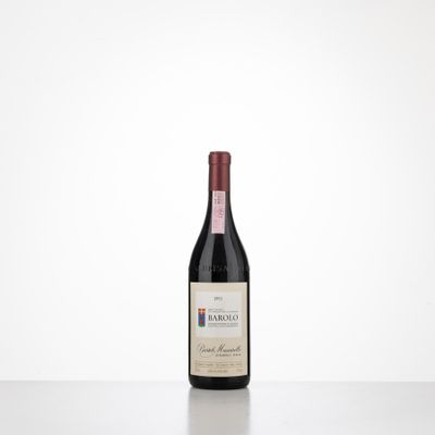 a bottle of red wine sitting on top of a table