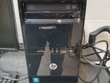 a desktop computer sitting next to a keyboard and mouse
