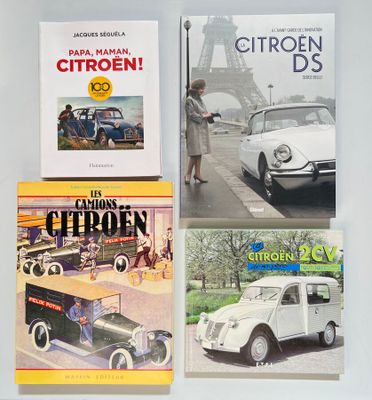 three books on a table with a car and a car in front of them