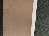 a close up of a piece of wood with a hole in it