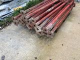 a pile of old rusty pipes on the ground