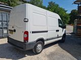 a white van that is parked in a parking lot