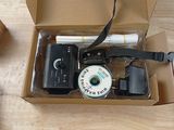 a box that has a camera and other items inside of it