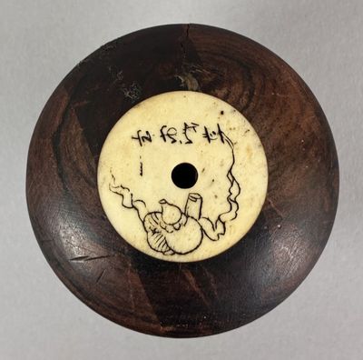 a picture of a wooden object with a drawing on it