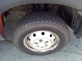 a close up of a flat tire on a car