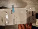 a person holding a box with a price tag on it